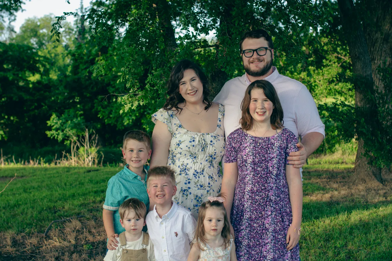 The family behind Five C Cottage Bakery, standing together under a tree